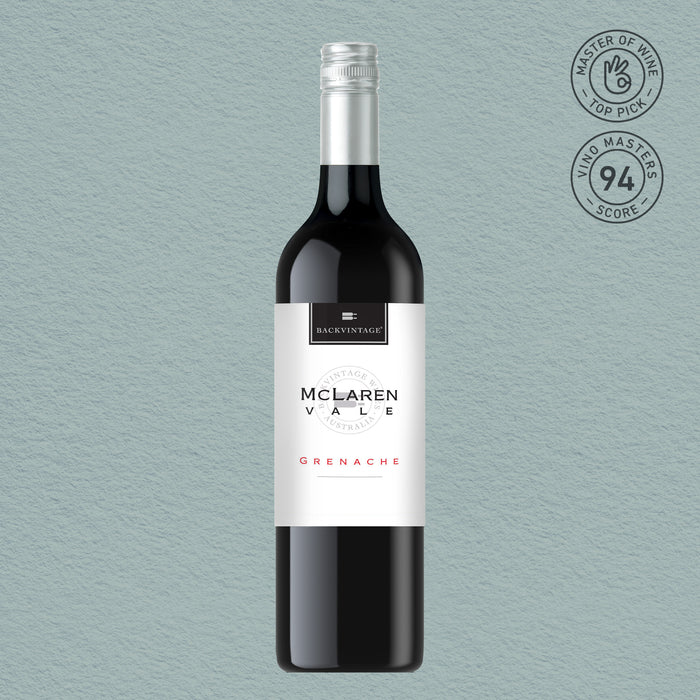 Bottle of McLaren Vale Grenache wine on a light blue background