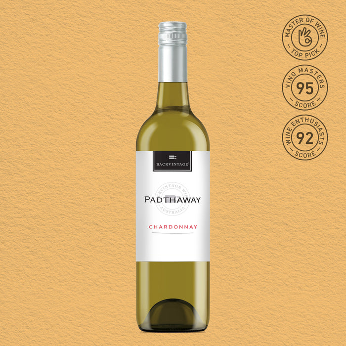 A bottle of Buck Vintage Padthaway Chardonnay white wine centered on a textured beige background, with three circular wine quality badges on the top right.